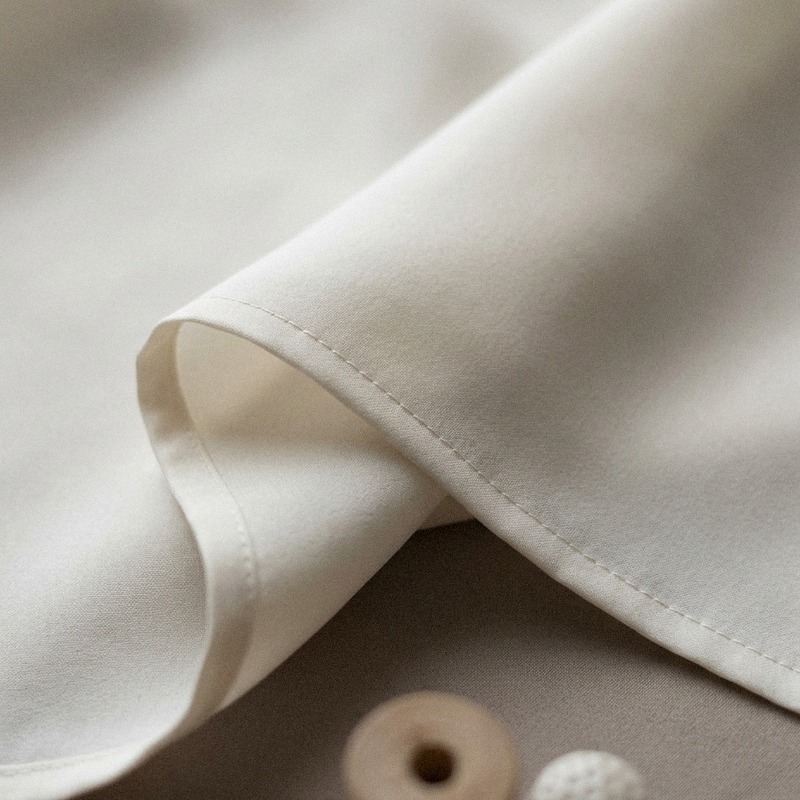 Hand-rolled hem with a fine stitch line